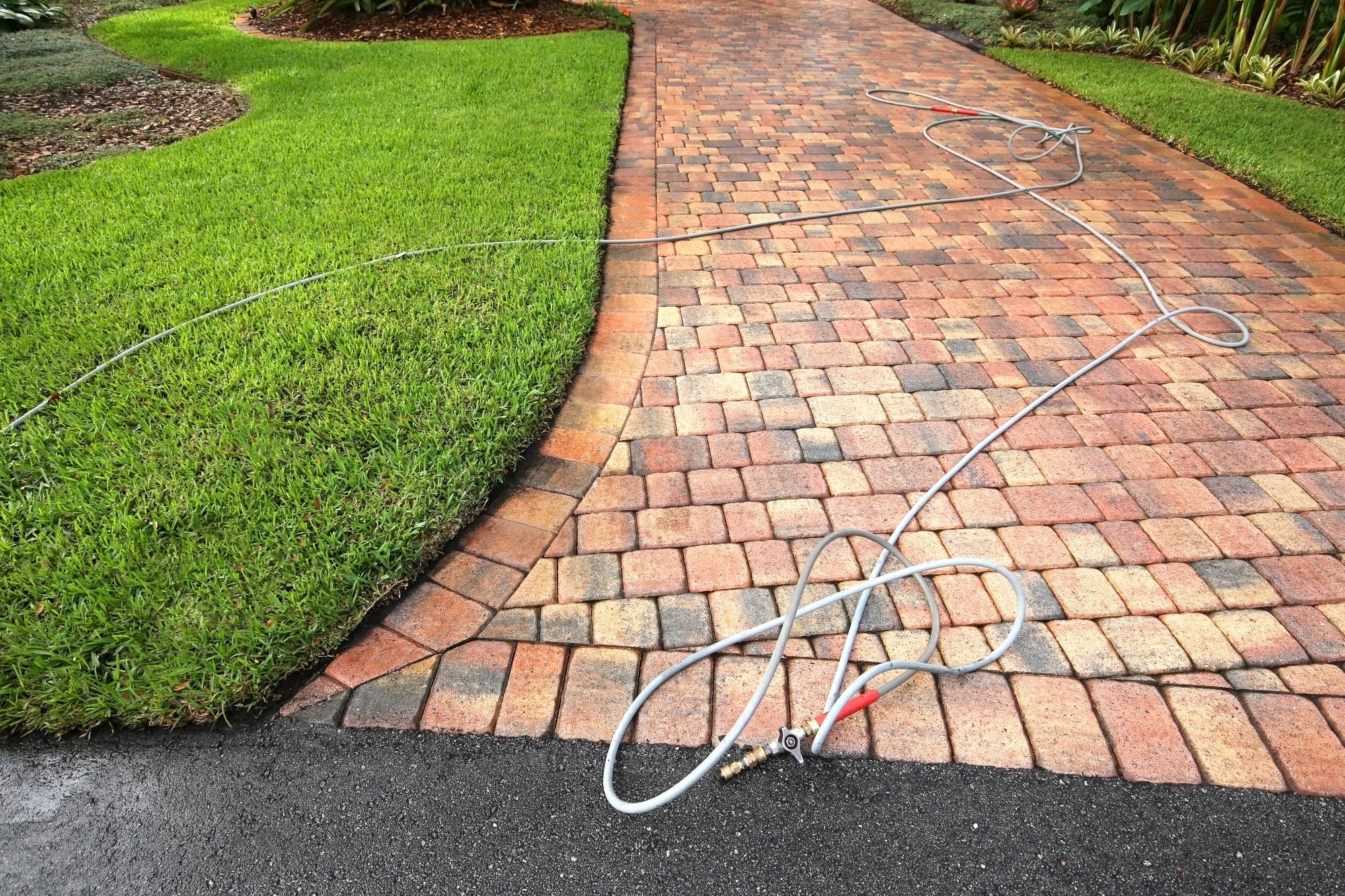 Recently pressure washed block paved driveway